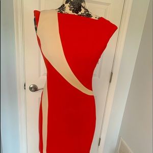 Gorgeous form fitting dress by Rachel Roy. Size 6. Coral red.